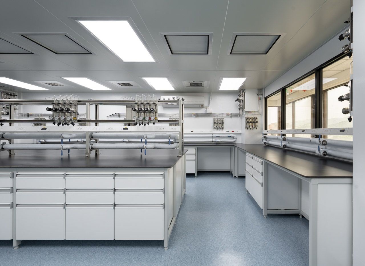 Process laboratory with stainless service manifolds above the benching